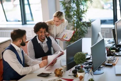 Business team and software developers working as a team in office. Stock Photos