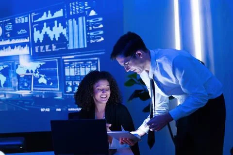 Business team collaborates on data analysis in modern office setting during.. Stock Photos