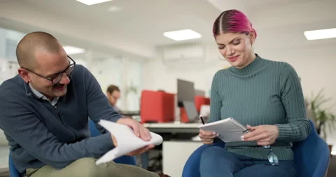 Business team collaborates in modern office with focus on planning and document Stock Footage 338357941