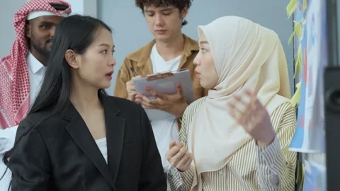 Business team collaborating on creative project Stock Footage 286081922