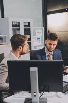 Business team collaborating on digital data analysis in modern office Photos