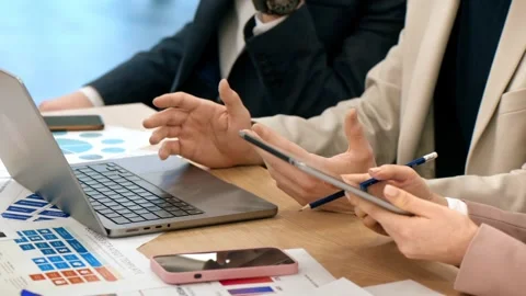 Business team collaborating on strategy using laptop and digital tablet in .. Stock Footage 339645225