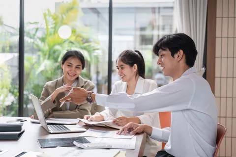 Business Team Collaborating on Work Plans During a Meeting in a Modern Office Stock Photos