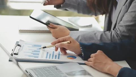 Business team collaboration discussing working analyzing with financial dat.. Stock Footage 259671997