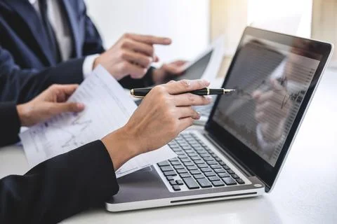 Business team colleagues working with computer, laptop, discussing and anal.. Stock Photos