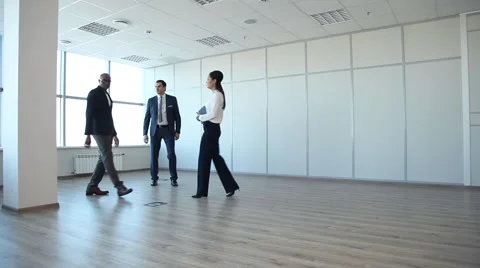 Business Team Comes in an Empty Office Stock Footage 61237085