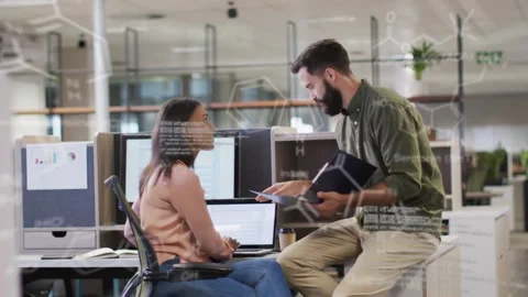 Business team coming perching pointing at laptop collaborating, code overlays Stock Footage 333574916