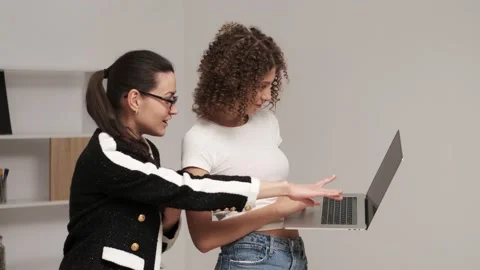 Business team concept. Two young women work in a team on a joint project Stock Footage 131141538