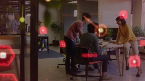 Business team at desk collaborating, seated member typing and activating AR Stock Footage 334040669