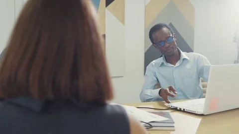 Business team discuss new projects. Uses a laptop in the office. business Stock Footage