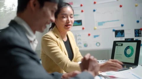 Business Team Discussing Analytics Report in Office Meeting Stock Footage 341878014