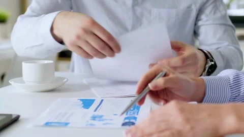 Business Team discussing on financial data together Close-up Hand unrecognized Stock-Footage 334653983