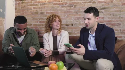 Business team discussing strategy on sofa Video stock 306133992
