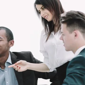 Business team discussing work problems sitting at their Desk Stock Photos