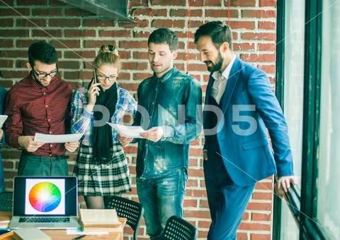 Business team with documents being prepared to discuss the new a Stock Photos