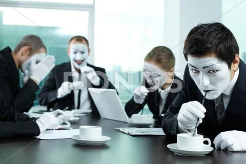 Business team drinking coffee straws in board room Stock Photos