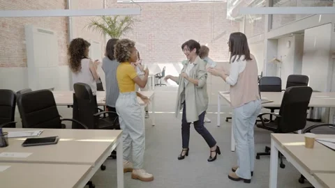 Business team enjoying success in modern office. Multiracial happy coworkers Stock Footage 166345775
