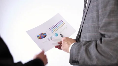 Business team examining graph 스톡 동영상 7744471