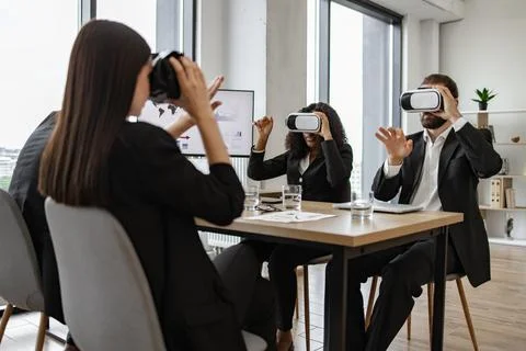 Business team exploring virtual reality during office meeting Stock Photos