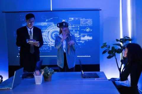 Business team exploring virtual reality technologies in a modern office set.. Stock Photos
