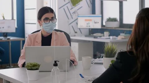 Business team with face masks working at marketing ideas Stock Photos