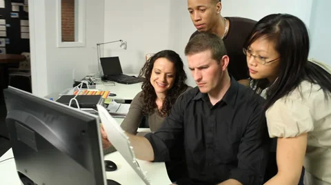 Business team looking at computer Stock-Footage 61656582