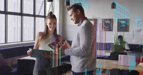 Business team members comparing printed data and tablet graphs while tapping, Stock Footage 314717108