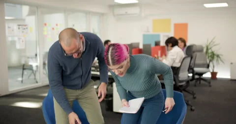 Business team in office works on projects, discusses ideas, collaborates on Stock Footage 338035341
