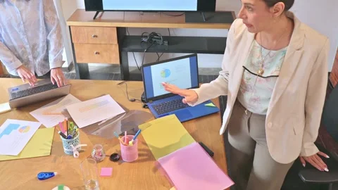 Business Team Organizing Table with Documents and Laptops. 動画素材 336569925