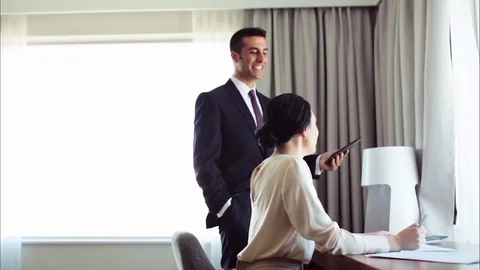 Business team with papers and tablet pc at hotel Stock Footage