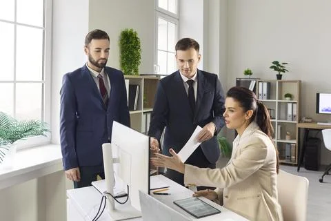 Business team planning strategy at computer in modern office data analysis Stock Photos