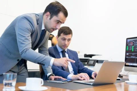Business team remotely solving a problem at business meeting using laptop Foto stock