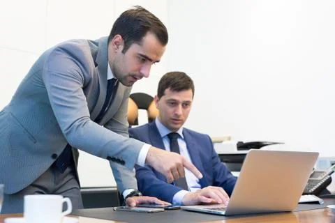 Business team remotely solving a problem at business meeting using laptop Stock Photos