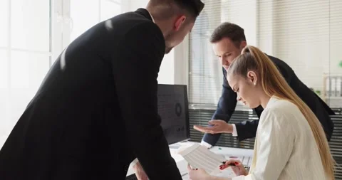 Business team reviewing charts on computer at office meeting for planning Stock Footage 337644376
