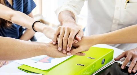 Business Team Stack Hands Support Concept. Four business people in formal w.. Stock Photos