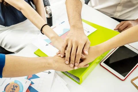 Business Team Stack Hands Support Concept. Four business people in formal w.. Stock Photos