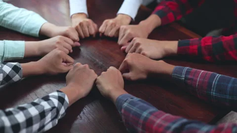 Business team stacking hands in a corporate office, symbolizing teamwork, c.. Stock-Footage 338001628