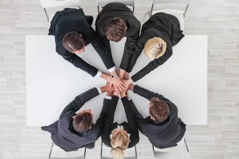 Business team stacking hands Stock Photos