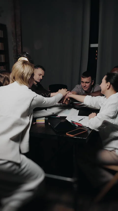 Business team stacking hands in unity during meeting. Stock Footage 347812143