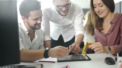 Business team with tablet pc computers, documents and coffee having discussion Видео 68205866