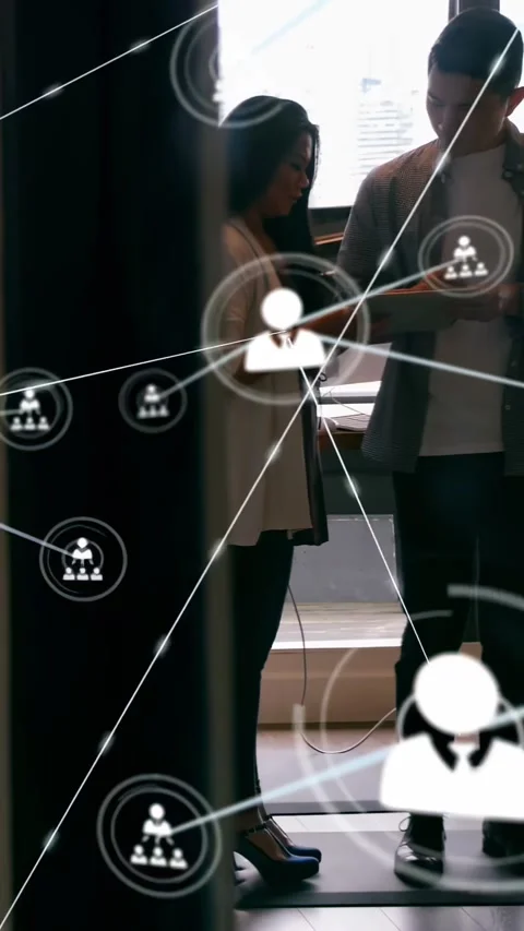 Business team tapping phone cable, showing tablet, network nodes expanding, Stock Footage 334397842