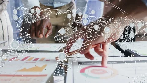 Business team tapping target chart on glass table, causing dotted map overlay Stock Footage 337905010