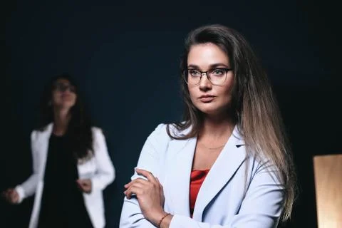 Business team of two young, successful and beautiful women. Stock Photos