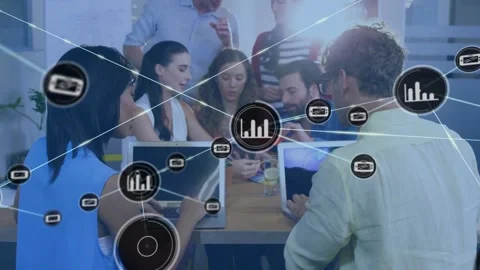 Business team typing and viewing device at table, single icon expanding into Stock Footage 330936151