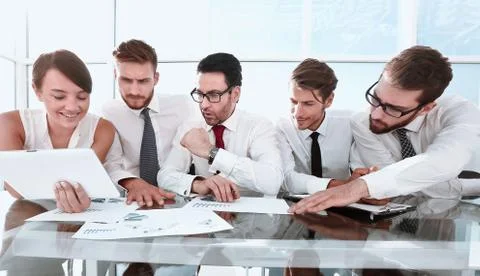 Business team using a digital tablet to work with financial data Stock Photos