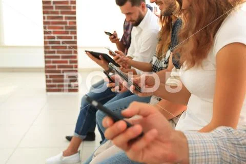 Business team using a mobile device Stock Photos