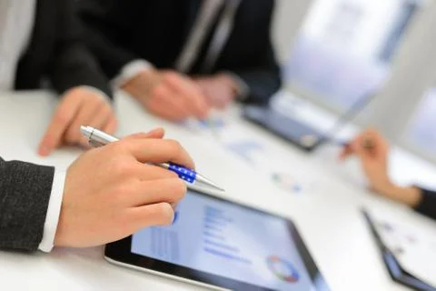 Business team using tablet computer to work with financial data Stock Photos