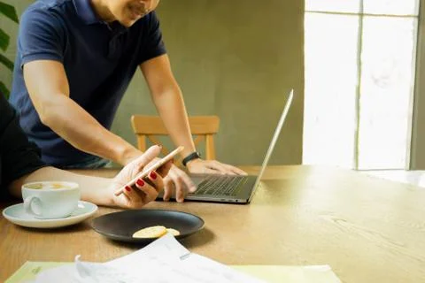 Business team work using cell phone and laptop working with documents paper. Stock Photos