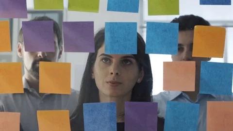 Business team working on a creative project with sticky notes Stock Footage 108421252