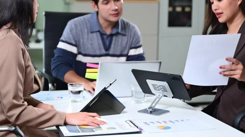 Business team working with digital tablets and reports in a modern office. .. Video stock 312439501